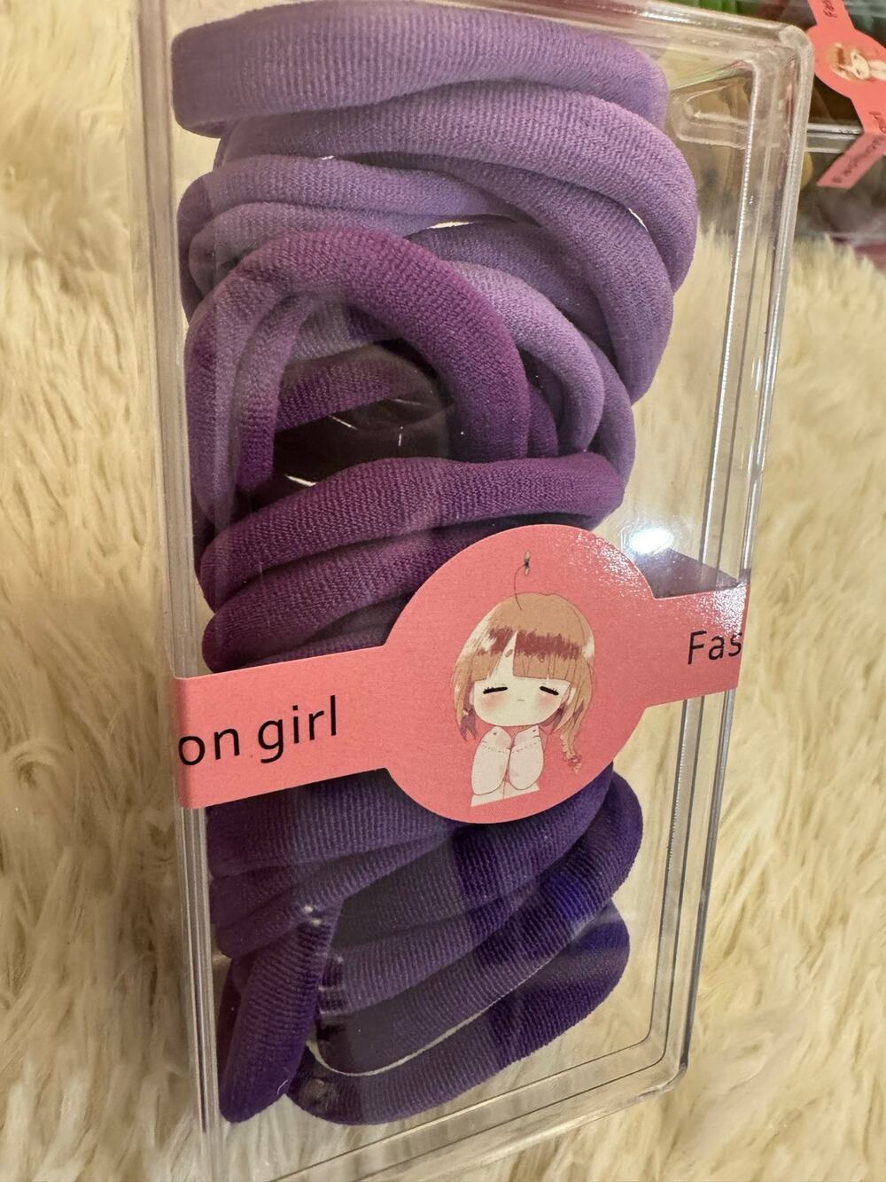 Girl ombré purple hair ties in a box ready to school or any use